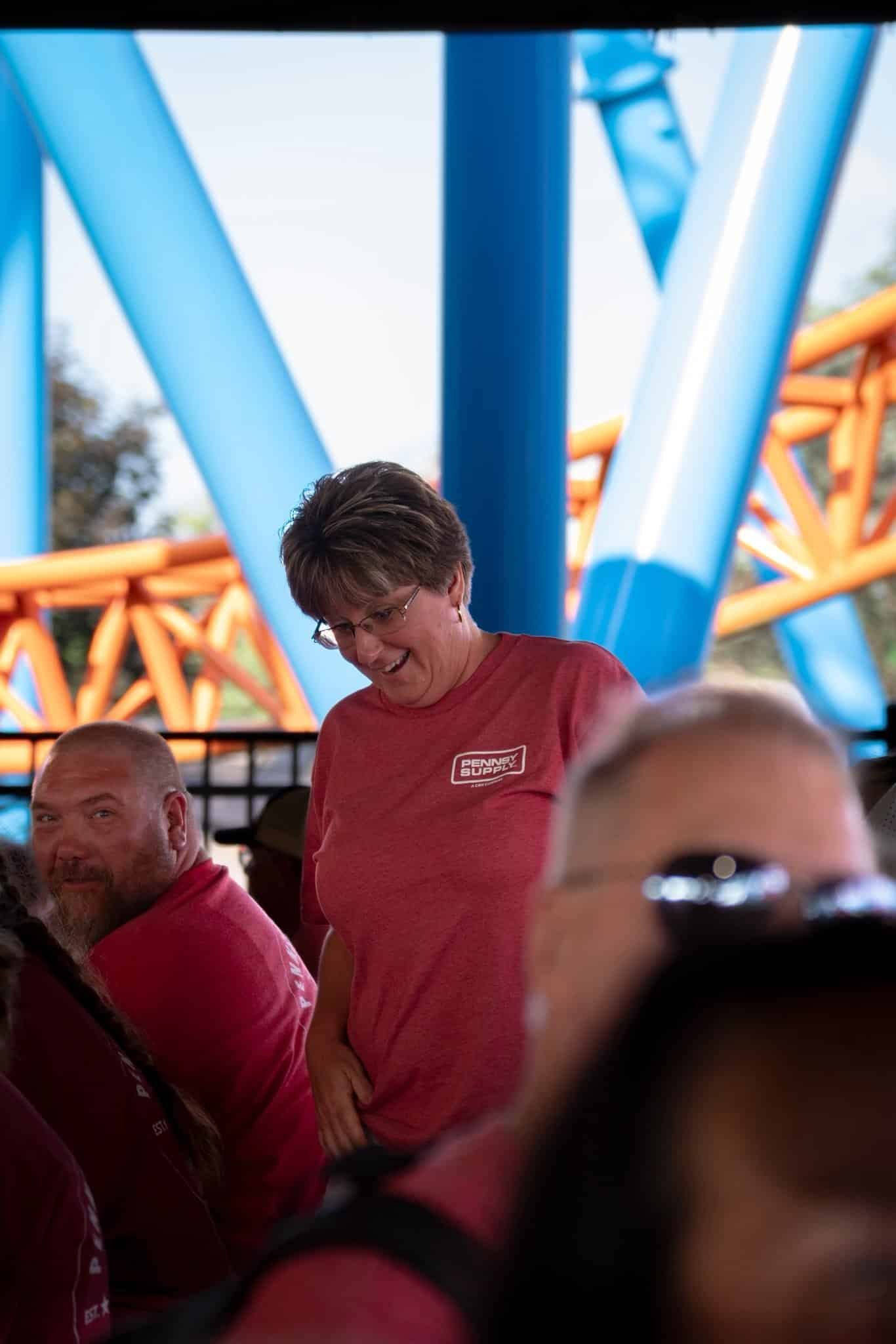 Picture of lady's reaction to winning a raffle at a corporate event.