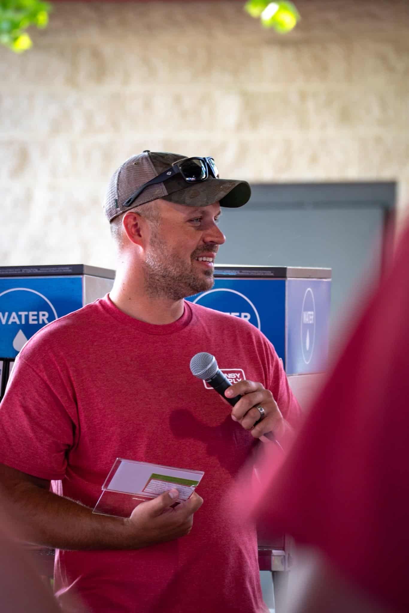 Announcer announcing raffle winners at a corporate event.