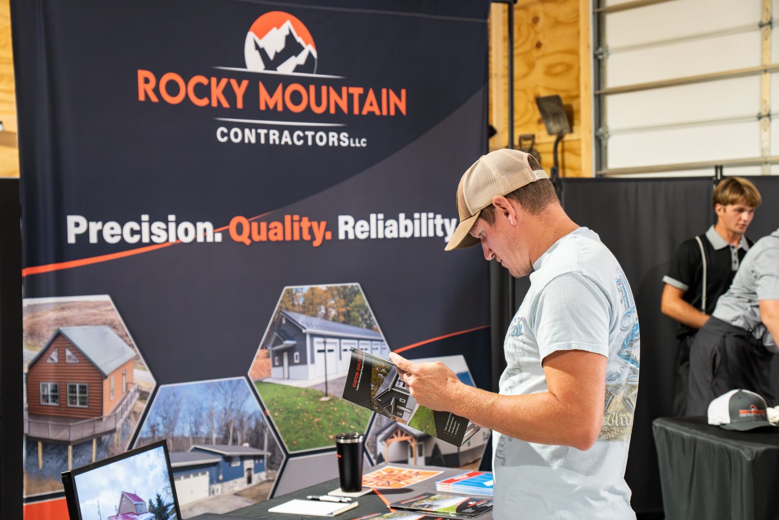 Photograph of man holding a magazine and learning about a business.
