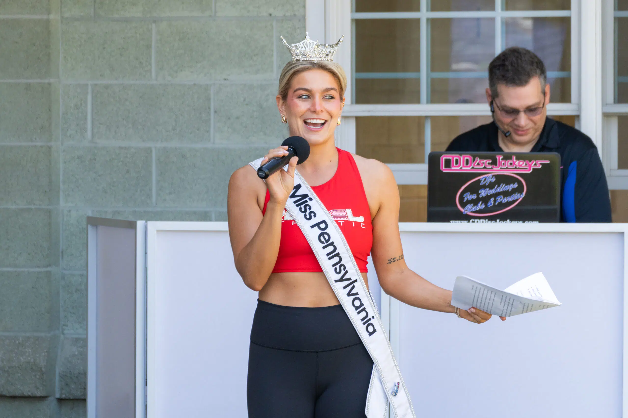 Miss PA announcing next speakers.