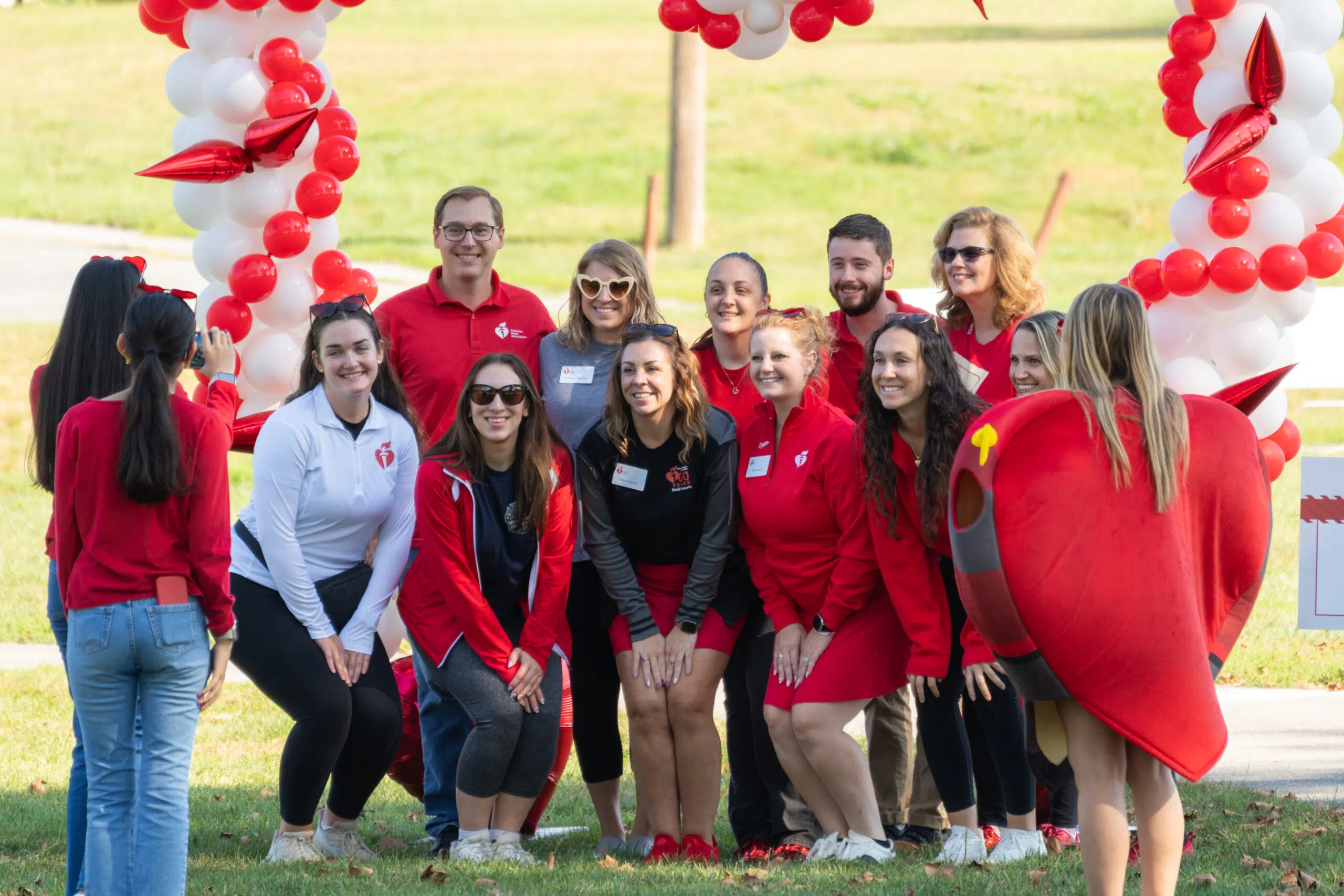 Staff of the event host grouped up and posing for a group photo.