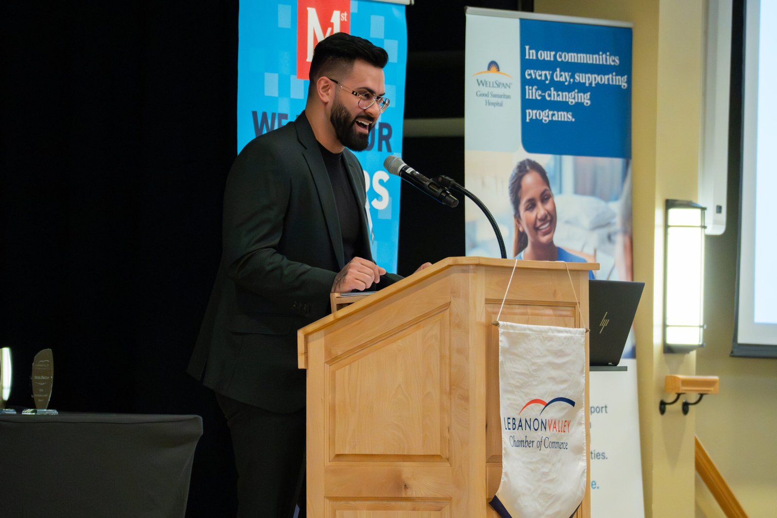 Guest Speaker is talking at awatd ceromony