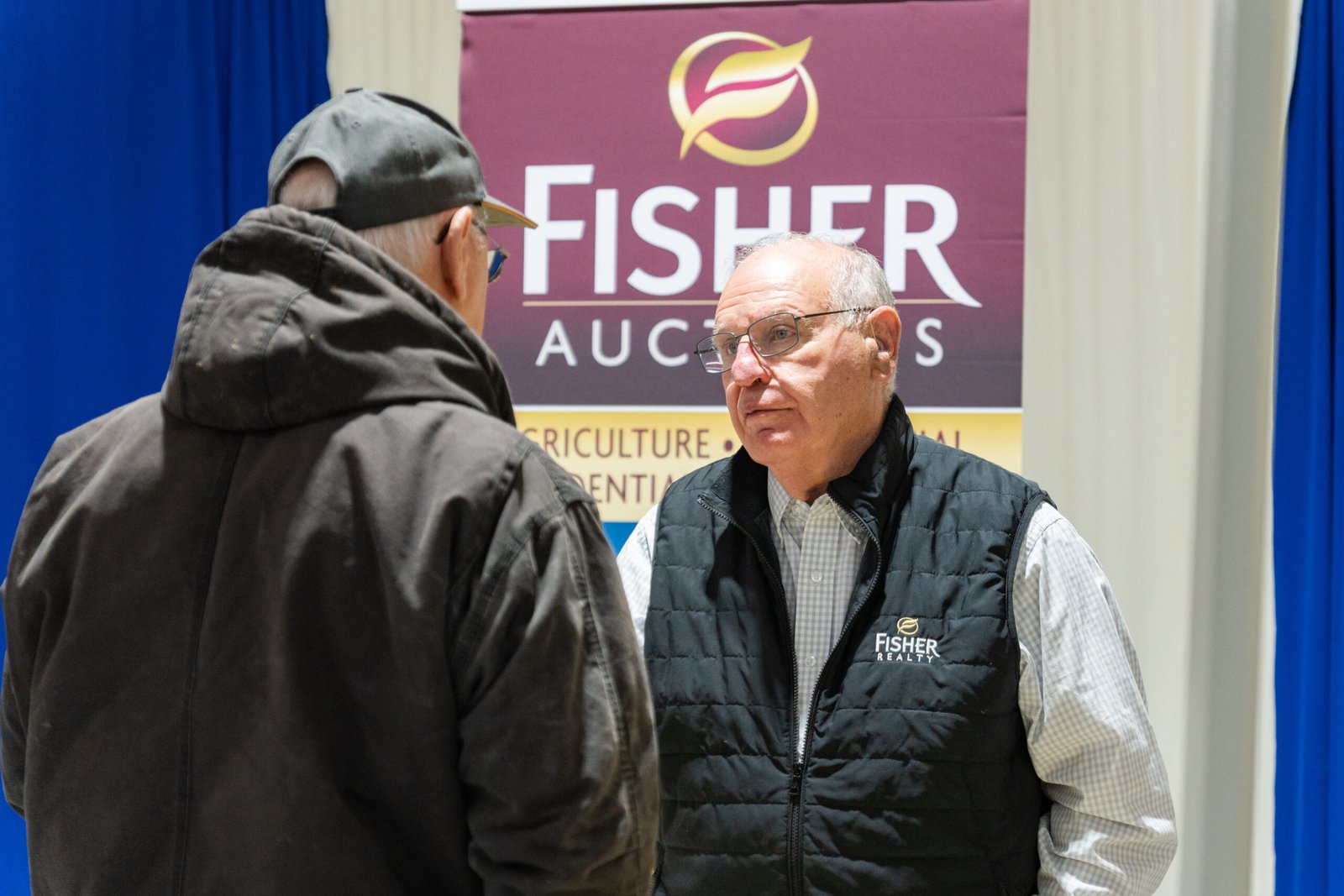 Two people having intense conversation in an event.