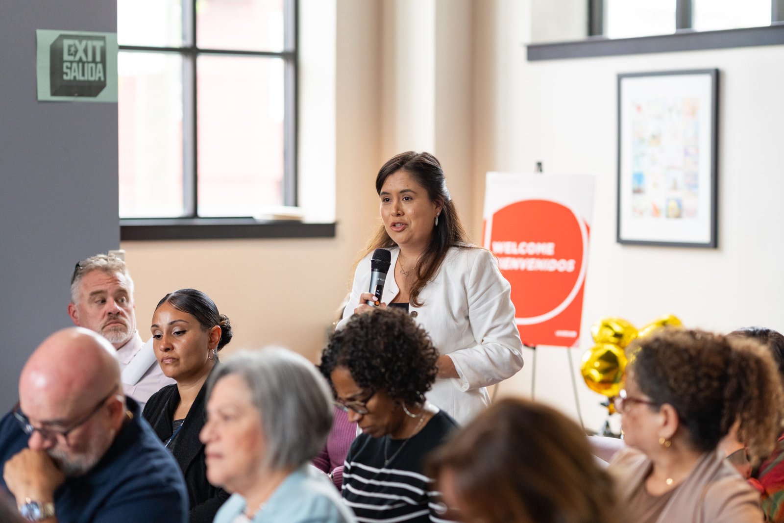 Photograph of women talking at a UNIDOS US event